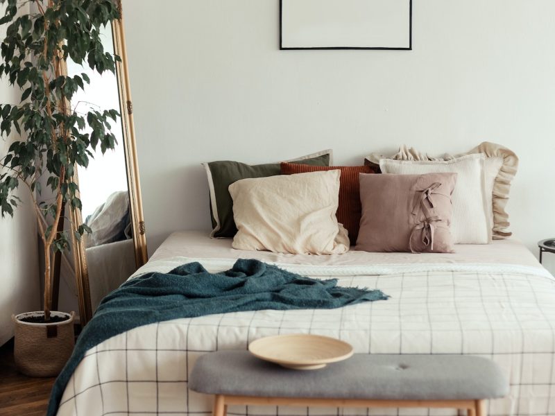 light-bedroom-rustic-interior-with-natural-materials-wooden-furniture-and-cotton-textiles-mock-up.jpg